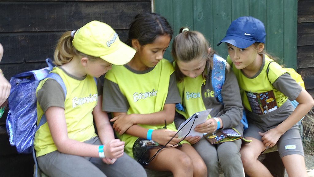 Brownies unlocking a combination padlock with a 3-digit code.