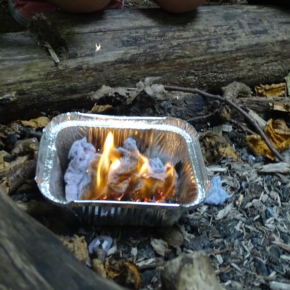 Fire created by Brownies using a flint and steel.