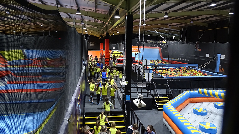 Brownies streaming to the jump zone at Soar Trampoline Park.